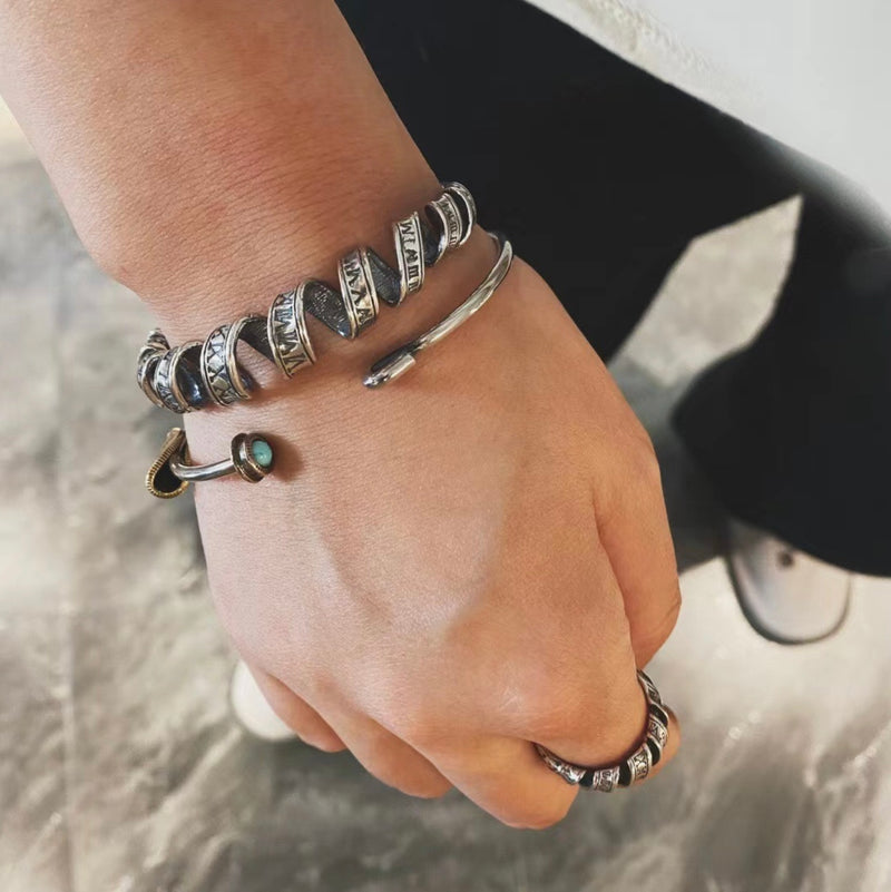"TWISTED TIME" ROMAN NUMERAL STERLING SILVER BRACELET